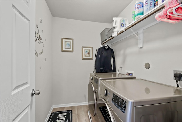 laundry area with separate washer and dryer