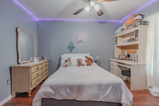 bedroom with ceiling fan and dark hardwood / wood-style floors