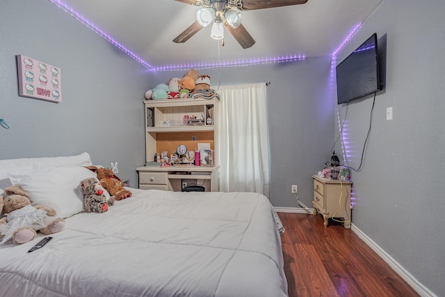 bedroom featuring ceiling fan and dark hardwood / wood-style flooring