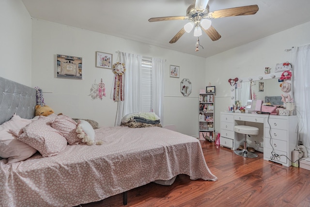 bedroom with dark wood-type flooring and ceiling fan