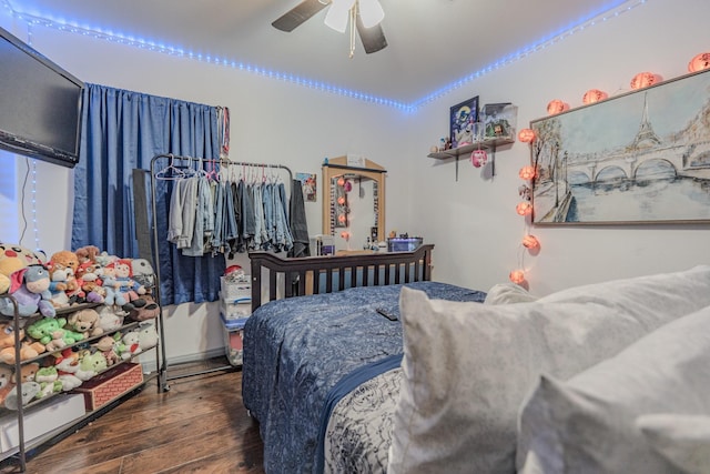 bedroom featuring ceiling fan and dark hardwood / wood-style floors