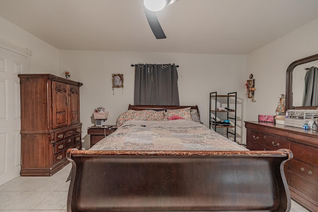 tiled bedroom with ceiling fan