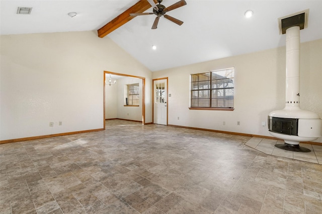 unfurnished living room with beamed ceiling, ceiling fan, high vaulted ceiling, and a wood stove