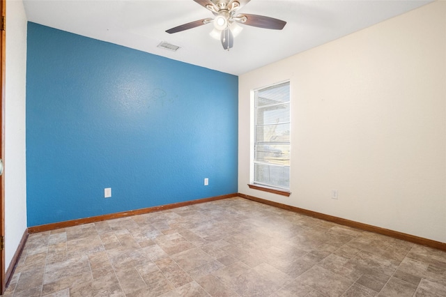 unfurnished room with ceiling fan