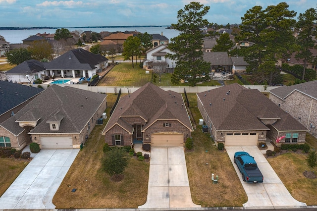 birds eye view of property with a water view