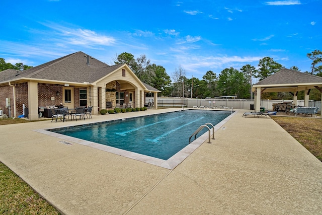 view of swimming pool with a patio area and a gazebo