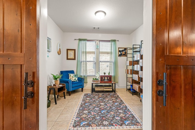 living area featuring light tile patterned flooring