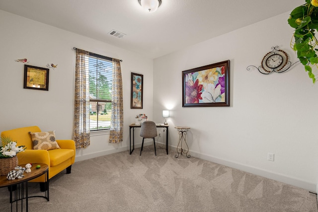 living area featuring carpet floors