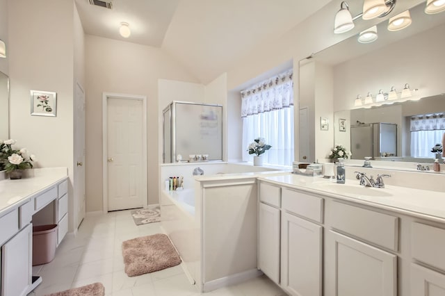 bathroom with vanity, separate shower and tub, and lofted ceiling