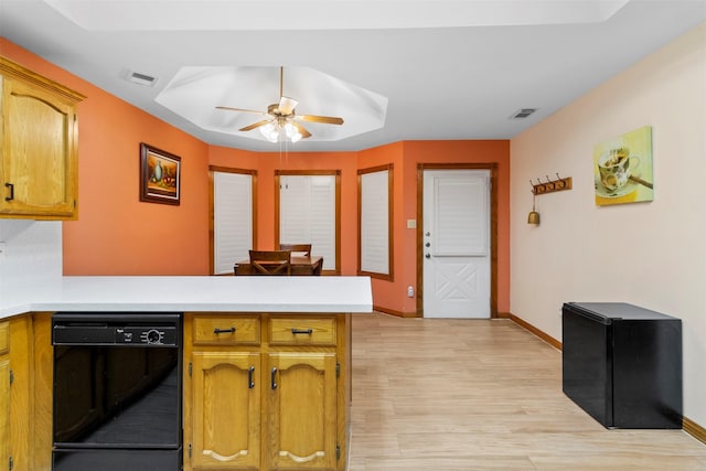 kitchen with ceiling fan, dishwasher, kitchen peninsula, and light wood-type flooring