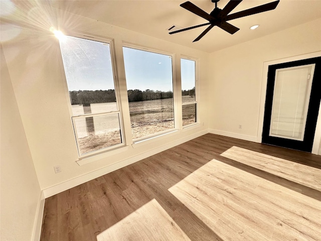 interior space with ceiling fan