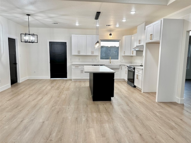 kitchen featuring white cabinetry, a kitchen island, and black range with electric cooktop