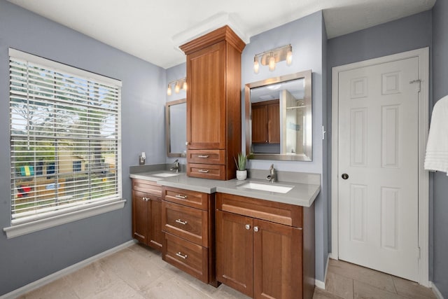 bathroom with tile patterned floors and vanity