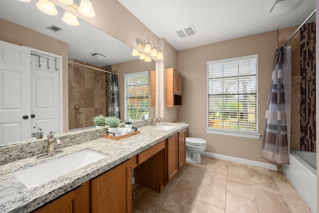 full bathroom with vanity, shower / bath combo, tile patterned floors, and toilet