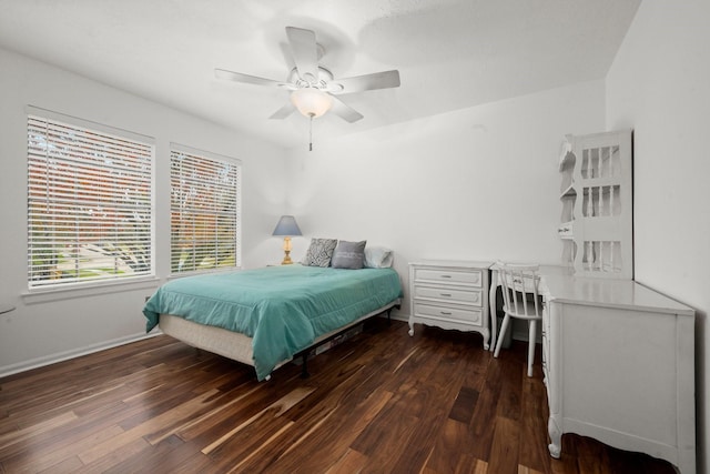 bedroom featuring dark hardwood / wood-style flooring and ceiling fan