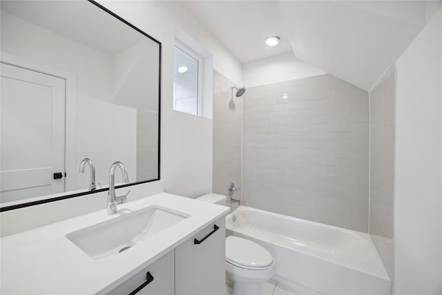 full bathroom with vanity, tiled shower / bath combo, and toilet