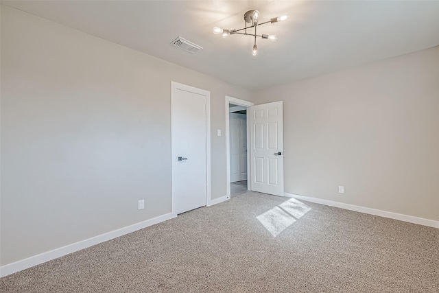 unfurnished bedroom featuring baseboards, visible vents, and carpet flooring