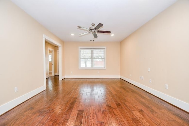 unfurnished room with ceiling fan and wood-type flooring