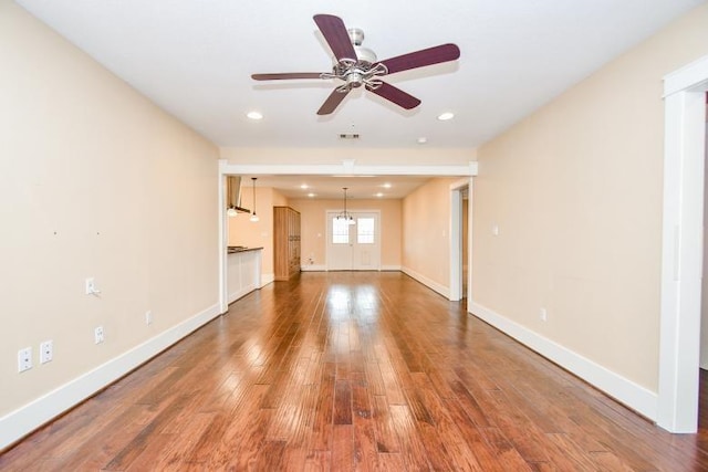 unfurnished living room with hardwood / wood-style floors and ceiling fan