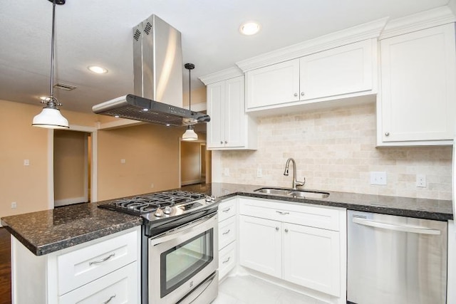 kitchen with white cabinets, pendant lighting, appliances with stainless steel finishes, and island range hood