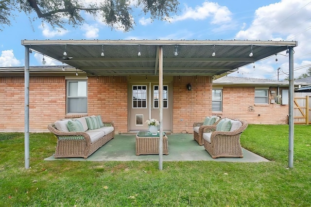 back of house with a patio, a lawn, and an outdoor hangout area