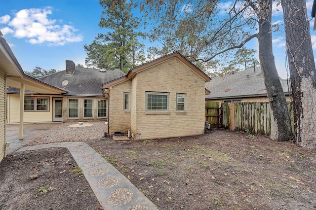 rear view of property featuring a patio