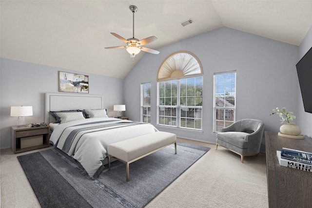 carpeted bedroom featuring vaulted ceiling and ceiling fan