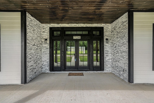 entrance to property featuring french doors