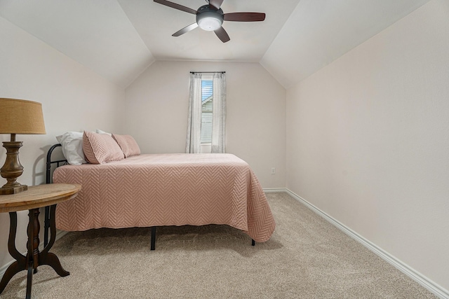 bedroom featuring light carpet, lofted ceiling, and ceiling fan