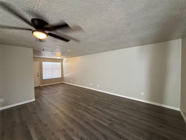 interior space with ceiling fan, dark hardwood / wood-style floors, and a textured ceiling