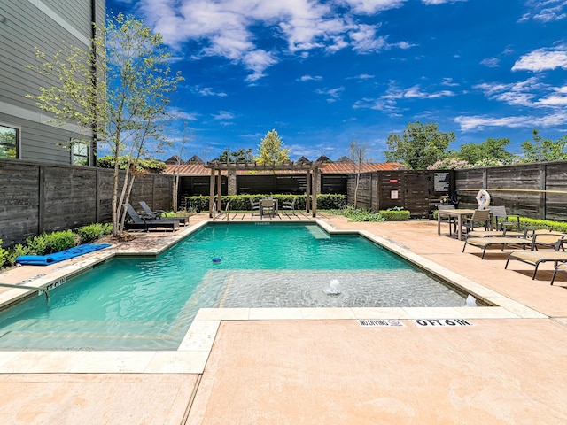 view of pool with a pergola and a patio