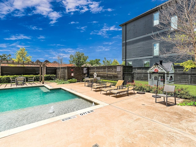 view of swimming pool featuring a pergola and a patio