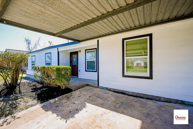 entrance to property with a patio area