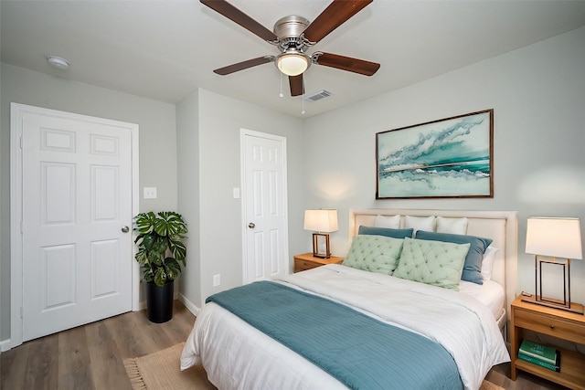 bedroom featuring hardwood / wood-style floors and ceiling fan