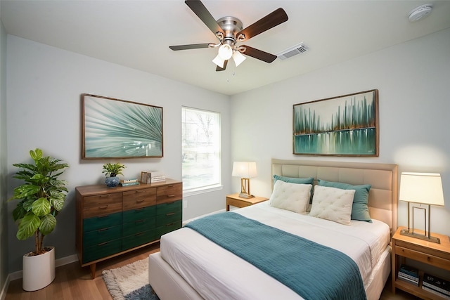 bedroom with ceiling fan and hardwood / wood-style floors