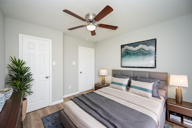 bedroom featuring ceiling fan and light hardwood / wood-style floors