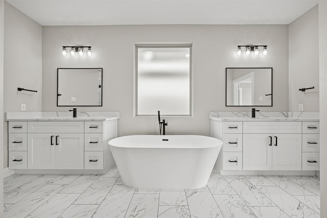 bathroom with vanity and a tub to relax in