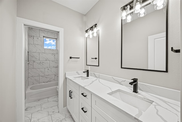 full bathroom with vanity, tiled shower / bath combo, and toilet