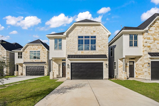 view of front of property featuring a garage and a front yard