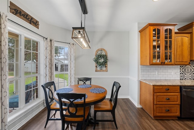 dining space featuring dark wood-type flooring