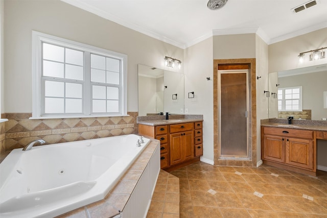 bathroom featuring ornamental molding, independent shower and bath, tile patterned flooring, and vanity