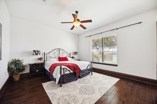 bedroom featuring ceiling fan and dark hardwood / wood-style floors