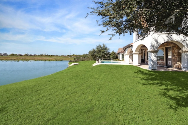 view of yard featuring a water view and a patio