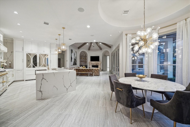 dining space with an inviting chandelier