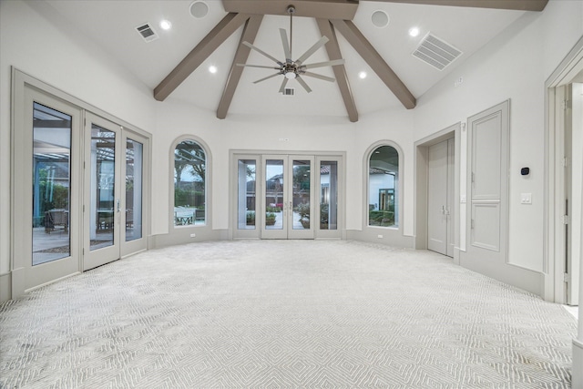 unfurnished sunroom with lofted ceiling with beams, french doors, and ceiling fan