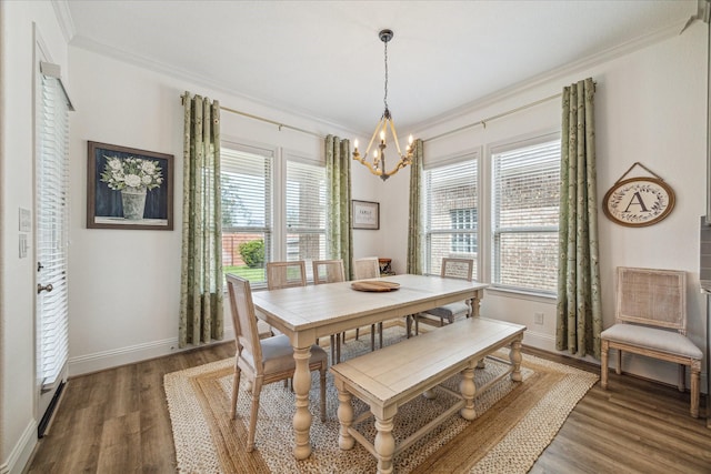 dining room with ornamental molding, dark hardwood / wood-style floors, and a wealth of natural light