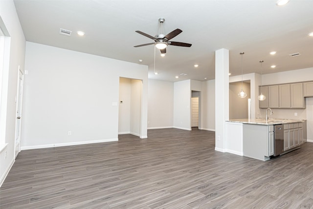 kitchen featuring recessed lighting, open floor plan, ceiling fan, and light wood-style flooring