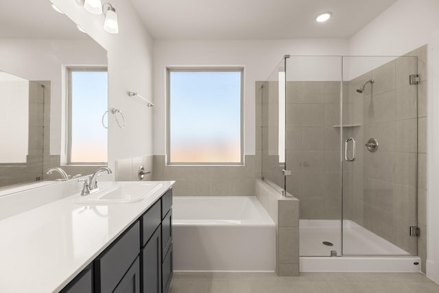 bathroom with vanity, independent shower and bath, and tile patterned flooring