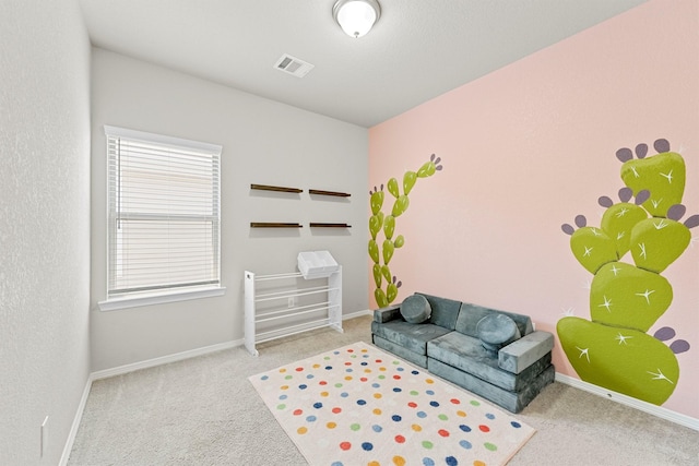 living area featuring light carpet