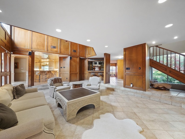 living room with wood walls